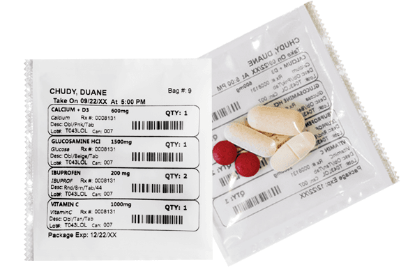 Medication pouches labeled with patient name, dose and time
