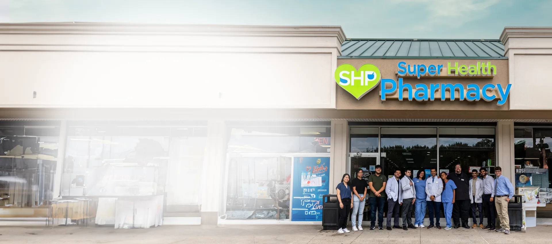 Super Health Pharmacy staff outside the pharmacy